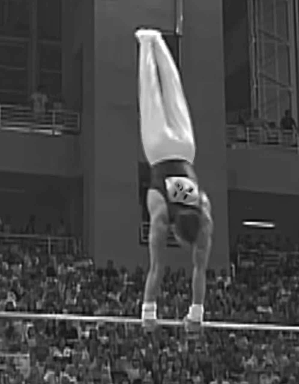 Young Carlos competing on the horizontal bar